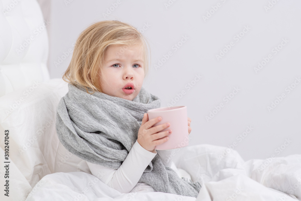 little sick girl drinking from a mug sitting on your bed little sick girl drinking from a mug sitting on your bed