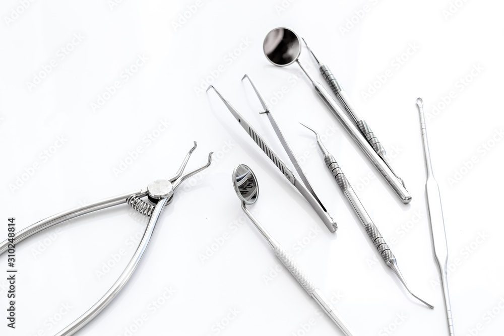 Dental instruments - set with mirrors - on white background close up Dental instruments - set with mirrors - on white background close up