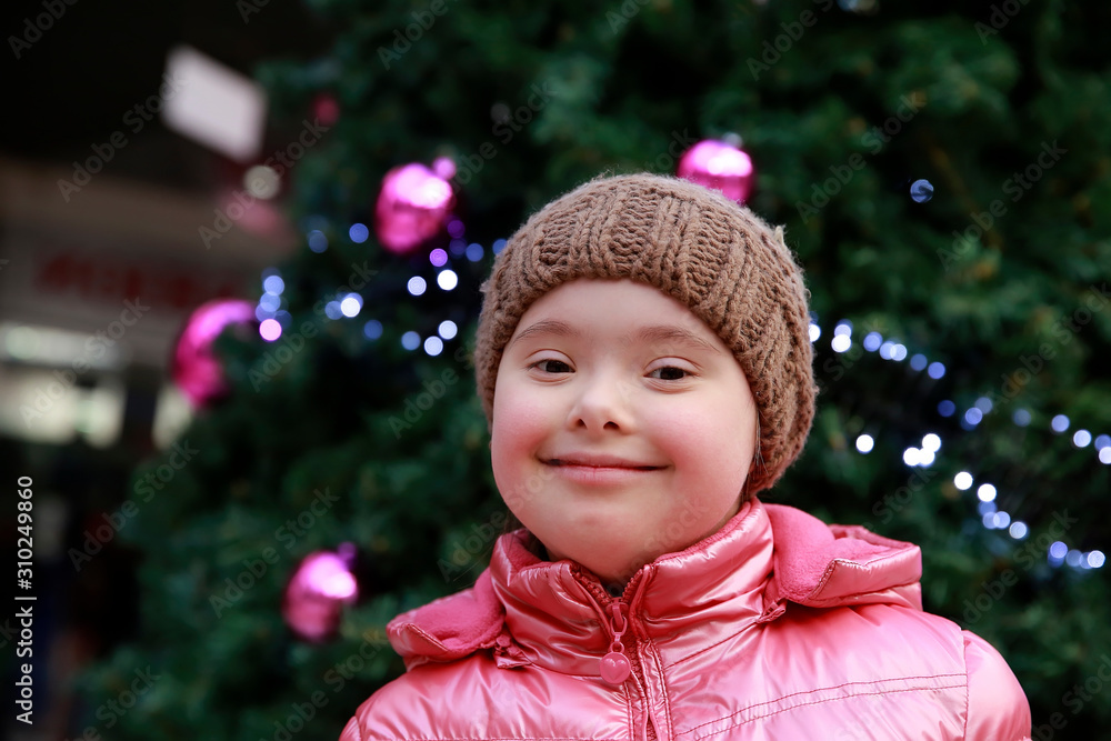 Portrait of young girl on background of the christmas tree Portrait of young girl on background of the christmas tree
