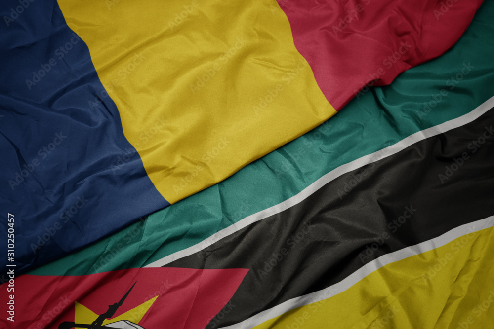 waving colorful flag of mozambique and national flag of chad. waving colorful flag of mozambique and national flag of chad.