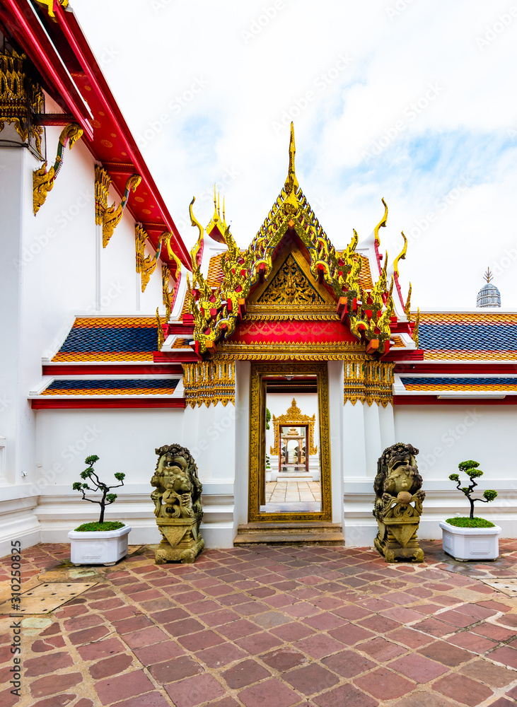 Wat Pho temple in Bangkok city, Thailand. View of pagoda and stupa in famous ancient temple. Religious buildings in buddhism style near Grand Palace. Oriental and Asian style, famous tourist target.