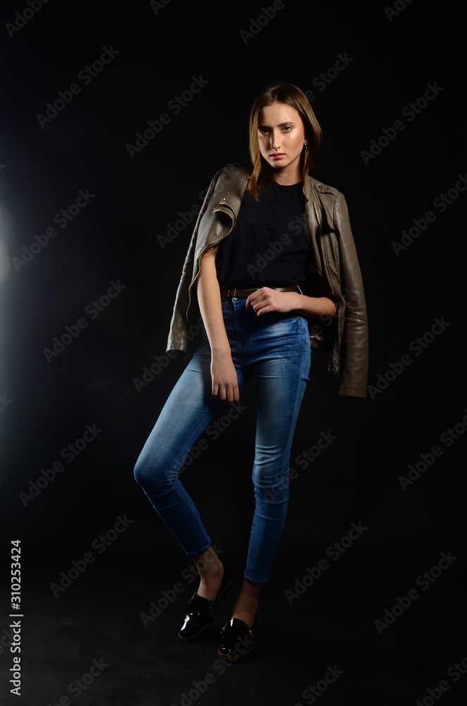 beautiful brunette in the studio on a black background beautiful brunette in the studio on a black background