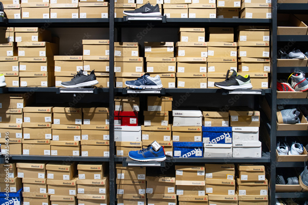 Russia, Nizhny Novgorod - November 4, 2019: Adidas shop in Nebo mall. Pair  sneakers on a store shelf. Shoe store. Close up view of sport footwear.  Retail shop in mall. Stock Photo | Adobe Stock