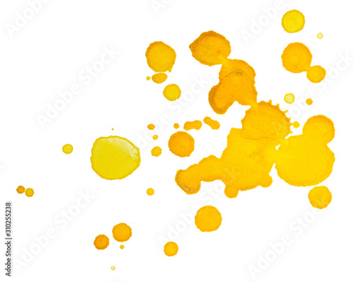 yellow specks droplets, splashes of paint on paper. on white background