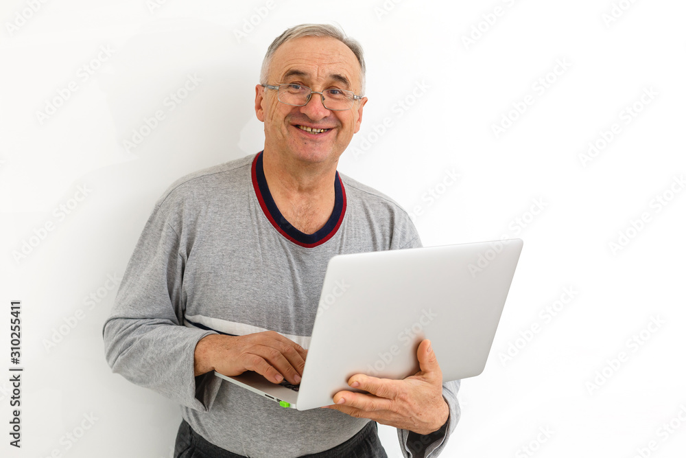 Smiling happy elderly man with laptop. Isolated over white background Smiling happy elderly man with laptop. Isolated over white background