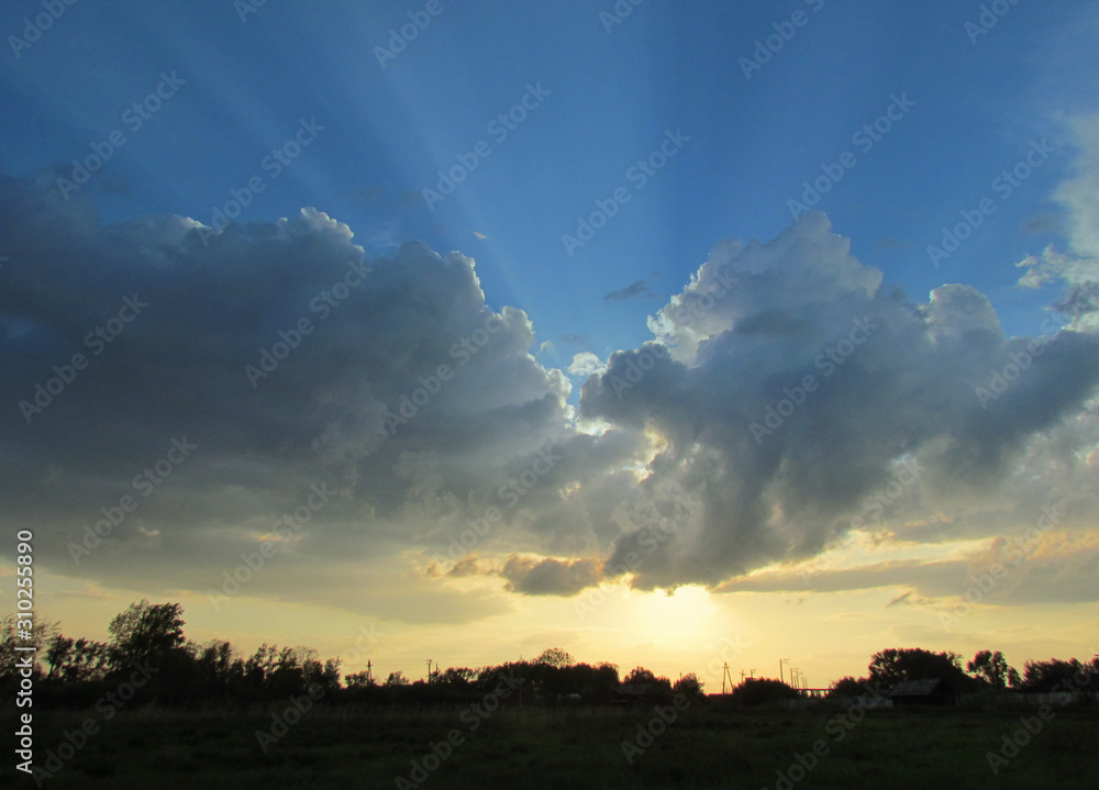 Landscape with sky,  dramatic clouds and sun      