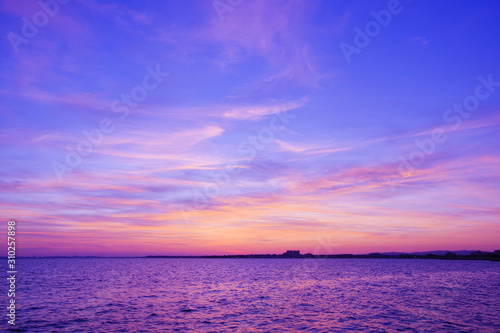 Colorful sunset over the sea. Purple sky. © Natalia