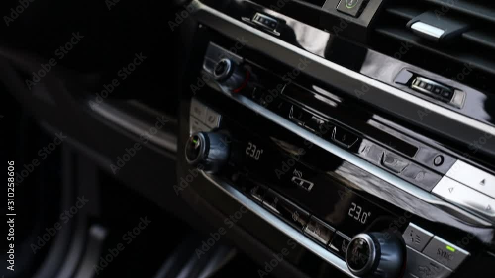 the dashboard is pulled into the brown leather of a premium crossover in dark colors. the dashboard is pulled into the brown leather of a premium crossover in dark colors.
