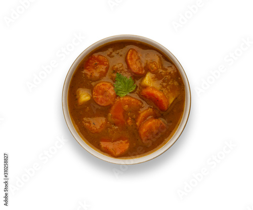 Isolated image of a bowl of delicious hearty winter vegetable soup, in a rustic bowl, with drop shadow.