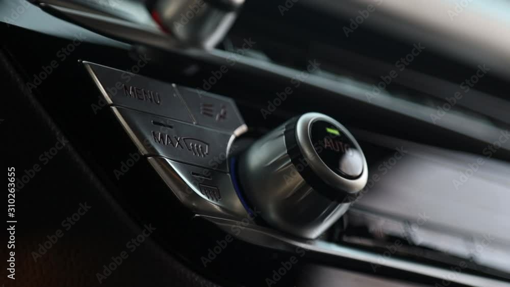The climate control buttons are silver. The climate system in automatic mode The climate control buttons are silver. The climate system in automatic mode