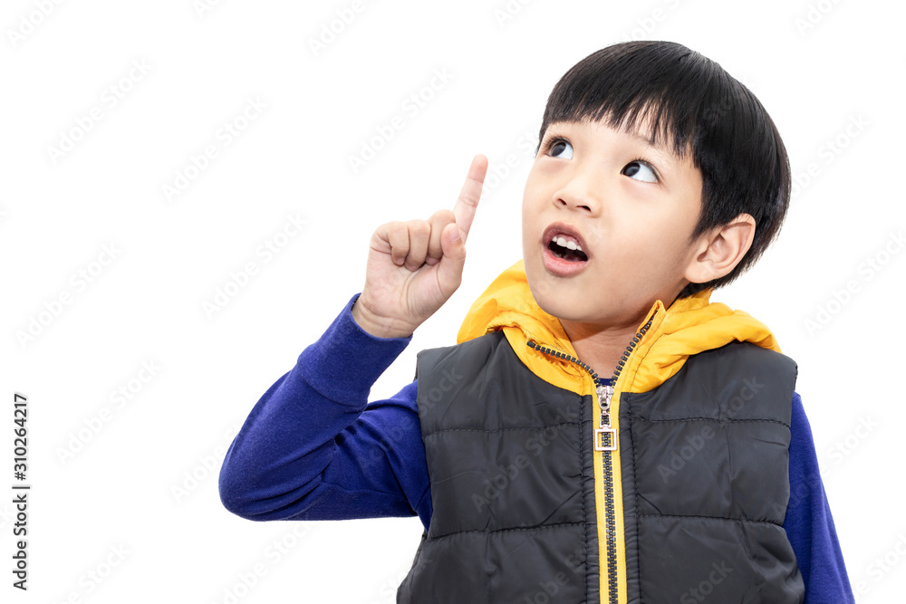 Little boy thinking and pointing finger up. Child looking up and surprised isolated on white background. Little boy thinking and pointing finger up. Child looking up and surprised isolated on white background.