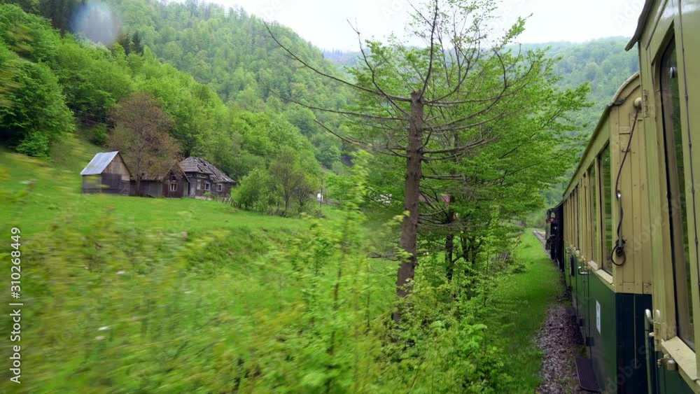 view from the roof of a retro train wagon, Old steam locomotive in Romania, Steam narrow gauge train, Steam train chugging through the countryside, narrow-gauge railway view from the roof of a retro train wagon, Old steam locomotive in Romania, Steam narrow gauge train, Steam train chugging through the countryside, narrow-gauge railway