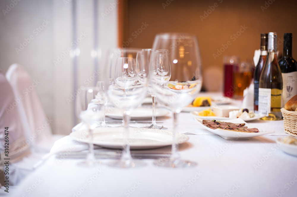 Empty wine glasses set in the restaurant. Empty wine glasses set in the restaurant.
