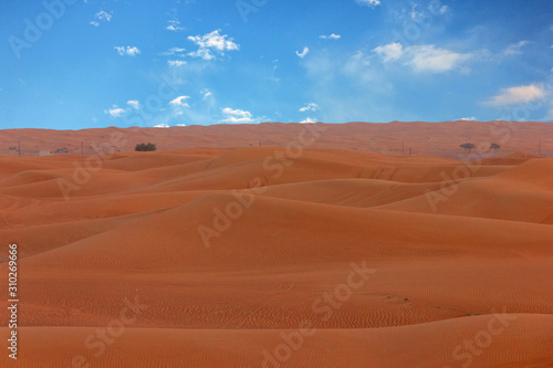 Sunset sky sand desert landscape  with dunes and red dramatic sunset picturesque view