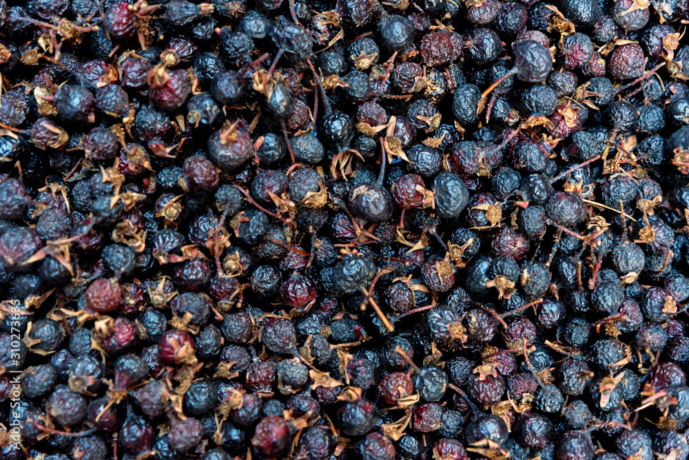 Close up pile of dried fruit of black rosehip or wild rose Close up pile of dried fruit of black rosehip or wild rose