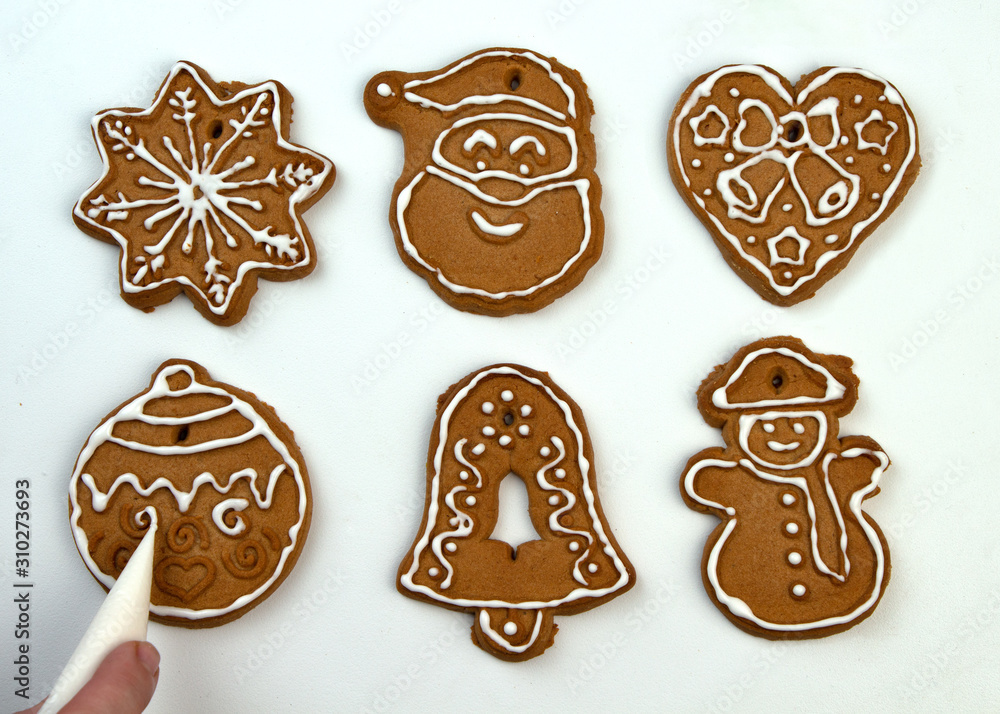 Christmas Ginger and Honey cookies on white surface. Star, fir tree, snowflake shape. Christmas Ginger and Honey cookies on white surface. Star, fir tree, snowflake shape.