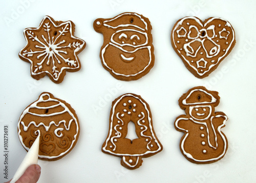 Christmas Ginger and Honey cookies on white surface. Star, fir tree, snowflake shape.