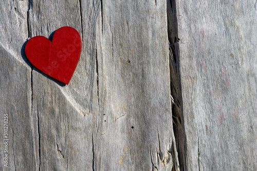 red heart on a wooden background