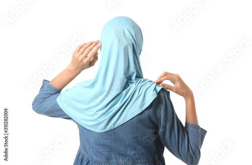 Beautiful Arab woman on white background, back view