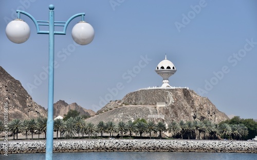 Riyam Incense Burner with Streetlamp in Foreground, Muscat, Oman photo