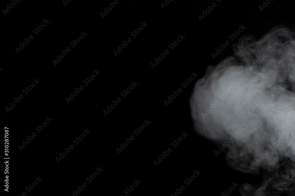 Beautiful puffs of white smoke randomly mixing slowly fill the blackness of the frame Beautiful puffs of white smoke randomly mixing slowly fill the blackness of the frame