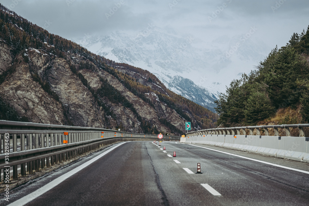BARDONECCHIA, ITALY / NOVEMBER 2019: View of the Alps along the road to the Frejus tunnel