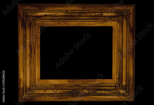 Gilded vintage rectangular frame close-up. Isolated object on a black background.