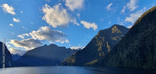 Milford Sound Fjord, Milford Sound / New Zealand - December 18, 2019: The Dramatic Mountains and Waterfalls of the Milford Sound Fjord, New Zealand photo