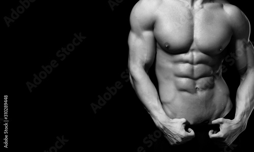 Perfect man body on black background