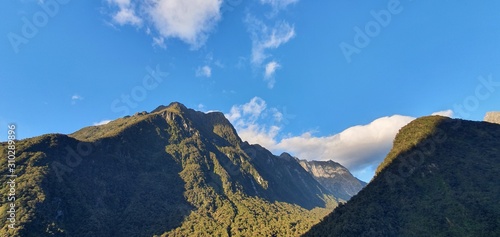 Milford Sound Fjord, Milford Sound / New Zealand - December 18, 2019: The Dramatic Mountains and Waterfalls of the Milford Sound Fjord, New Zealand photo