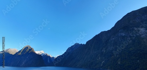 Milford Sound Fjord, Milford Sound / New Zealand - December 18, 2019: The Dramatic Mountains and Waterfalls of the Milford Sound Fjord, New Zealand photo