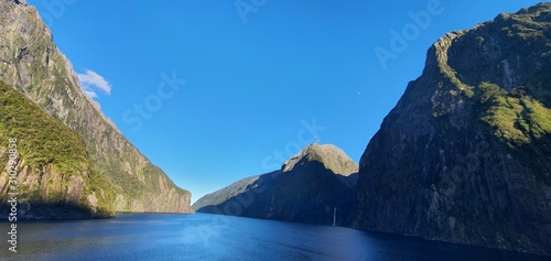 Milford Sound Fjord, Milford Sound / New Zealand - December 18, 2019: The Dramatic Mountains and Waterfalls of the Milford Sound Fjord, New Zealand photo