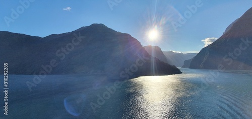 Milford Sound Fjord, Milford Sound / New Zealand - December 18, 2019: The Dramatic Mountains and Waterfalls of the Milford Sound Fjord, New Zealand photo