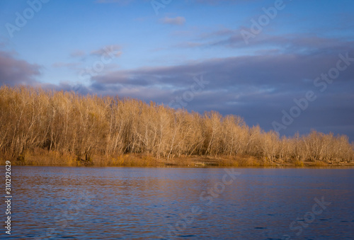 Autumn day landscape with a river