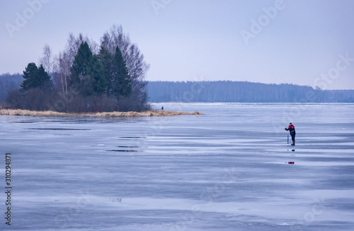 Winter fishing on the ice of russian river