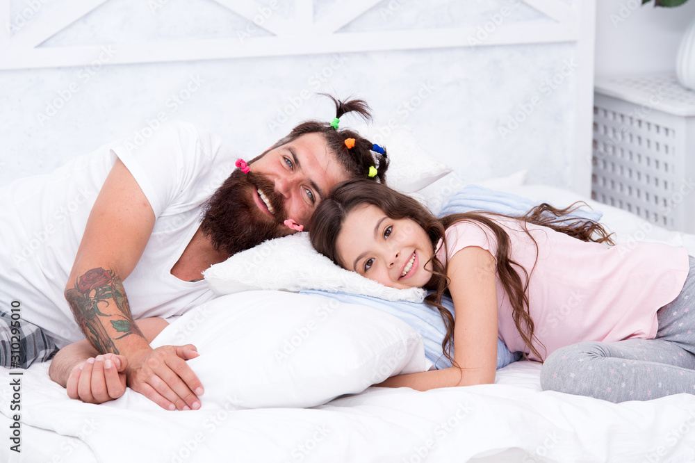 Enjoy better sleep at night. Bearded man put daughter to sleep. Tired child and father go to sleep. Bedtime routine. Got ready for bed. Good night. Sleep well Enjoy better sleep at night. Bearded man put daughter to sleep. Tired child and father go to sleep. Bedtime routine. Got ready for bed. Good night. Sleep well