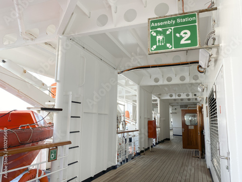 A cruise ship sign designating where the assembly station is in case of emergency.