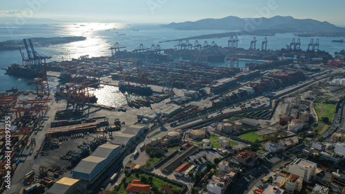Aerial drone photo of industrial cargo container terminal near Perama and commercial port of Piraeus, Attica, Greece