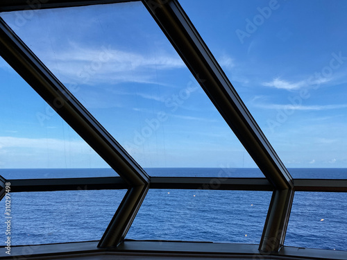 A cruise ship window overlooking the Atlantic Ocean.