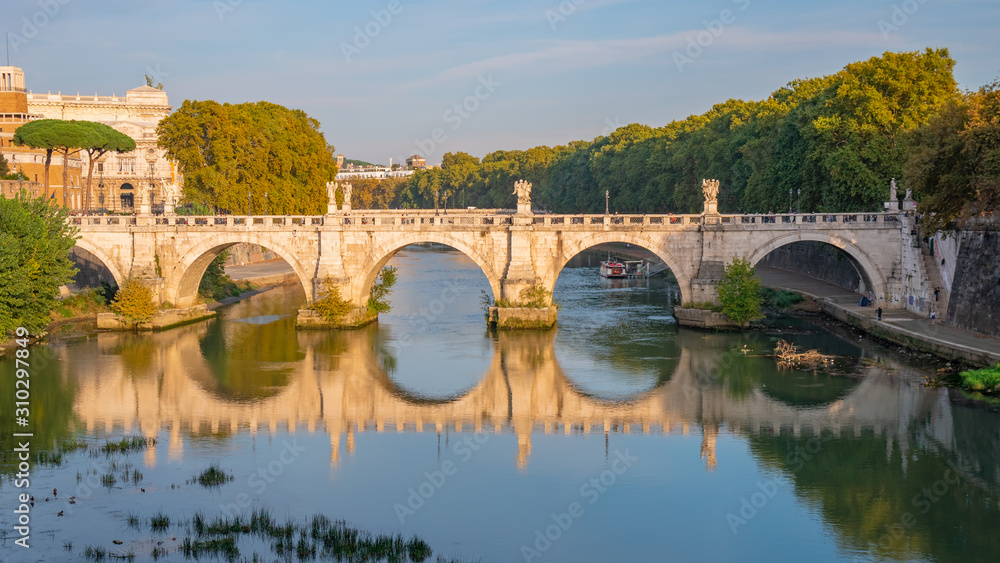 Beautiful view on Saint Angel Castle and bridge over the Tiber river in Rome.