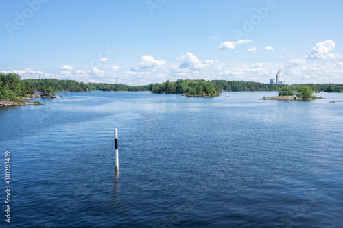 Beautiful view from the deck of the cruise ship going up the Lake Saimaa, Lappeenranta, Finland on a warm sunny day.