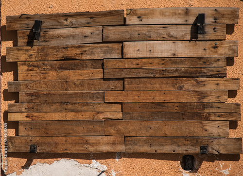  close up of an empty wooden sign board on wall