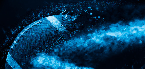 American football ball close up on black background. Blue filter
