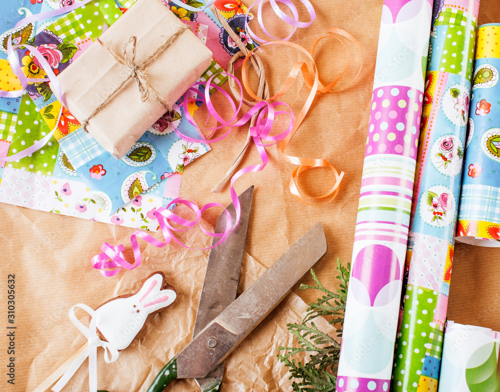 lot of stuff for handmade gifts, scissors, ribbon, paper with countryside pattern, ready for holiday concept, nobody home lot of stuff for handmade gifts, scissors, ribbon, paper with countryside pattern, ready for holiday concept, nobody home