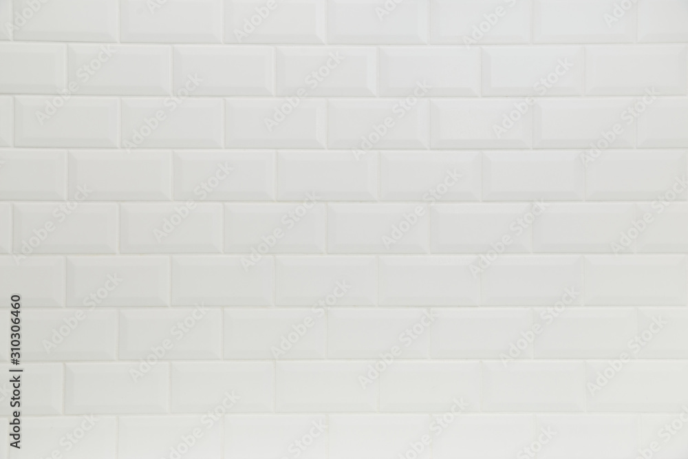 Naklejka premium Bathroom wall tiled in scandinavian classic brick style with white grouting.