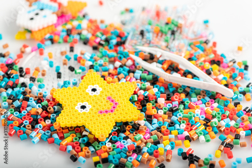 Toy in star form. Just made of fusible beads. Set, close up view