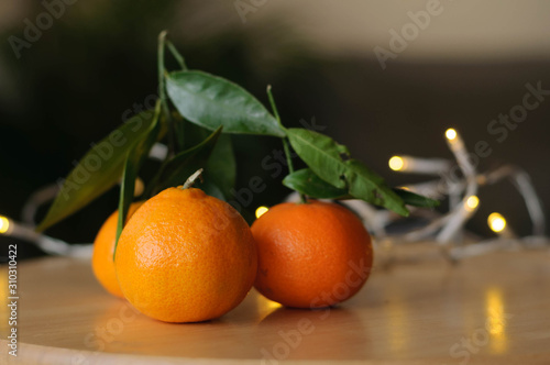 tangerines on the table and garlands