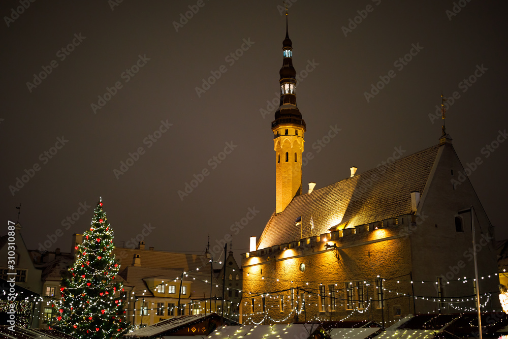 Tallinn Christmas market at night, Christmas tree with decorations and lights