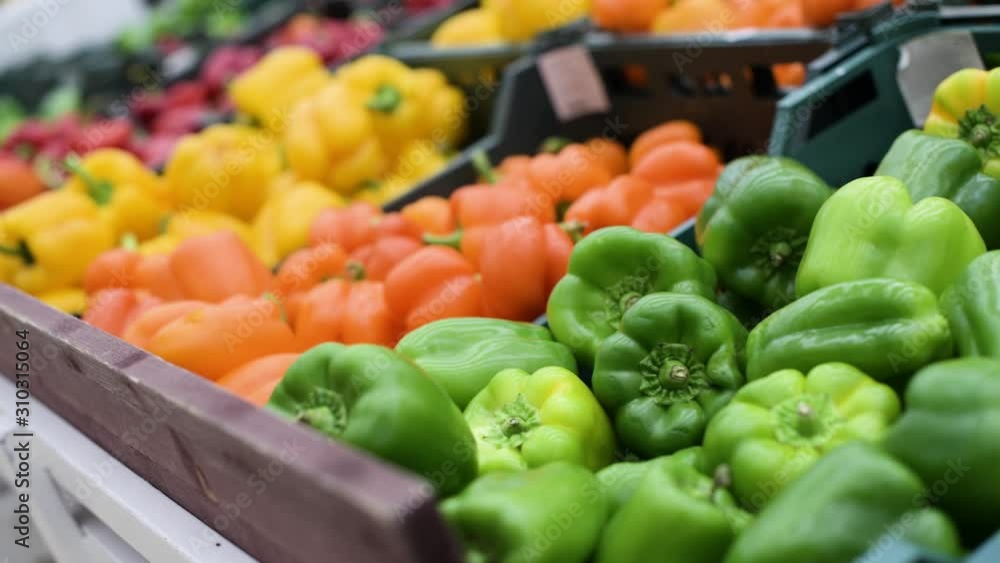 bell peppers of different colors lie on the counter of the grocery store, Selective focus bell peppers of different colors lie on the counter of the grocery store, Selective focus
