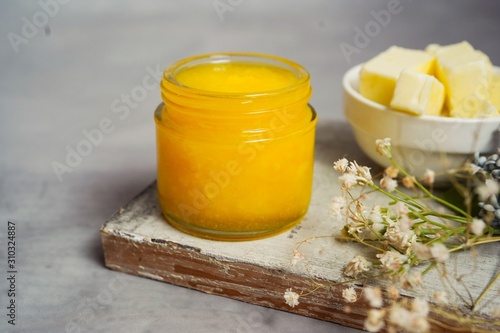 Cuadro en lienzo Homemade Ghee / Clarified butter in a glass jar, selective focus